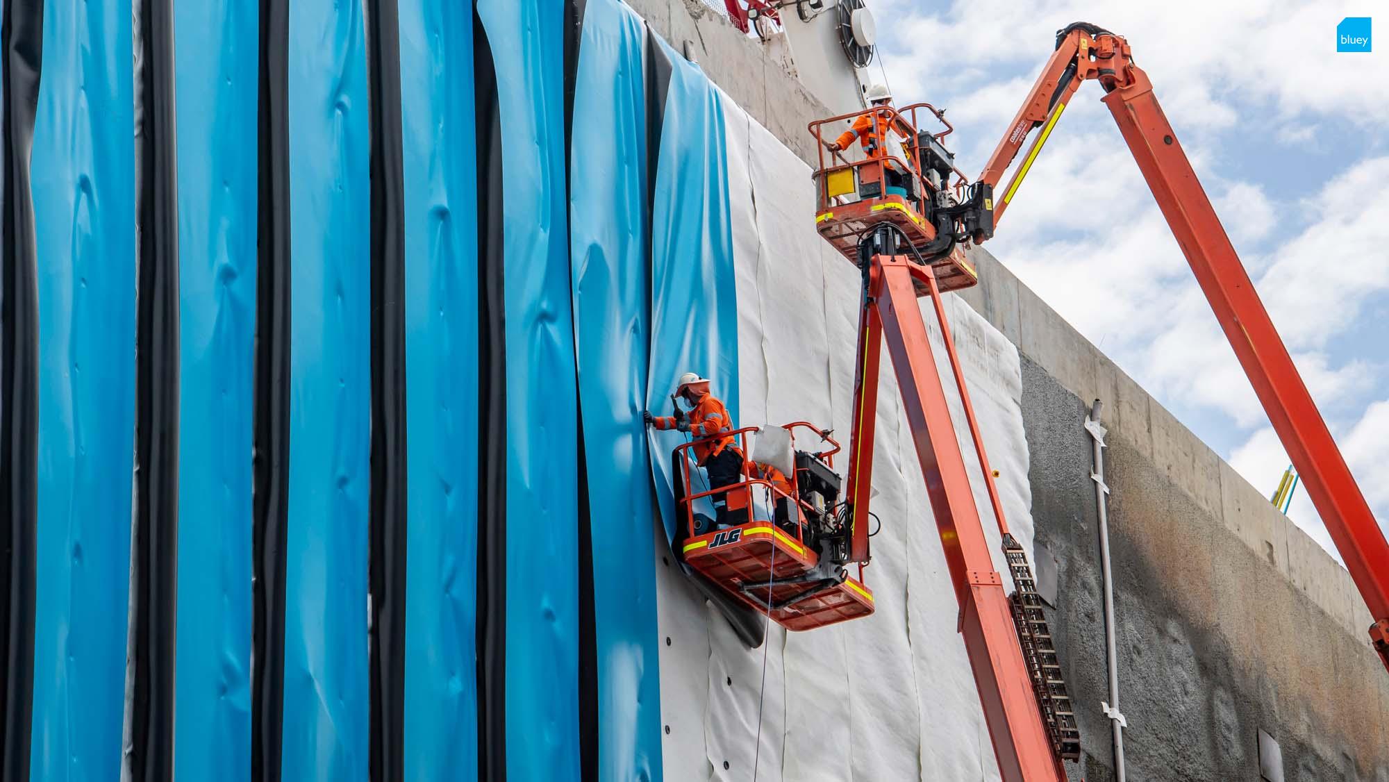 Waterproofing Technicians installing BluSeal PVC at the Sydney Metro Waterloo Station